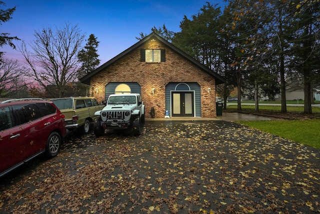 property exterior at dusk with french doors