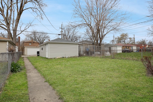 view of yard with an outdoor structure and a garage