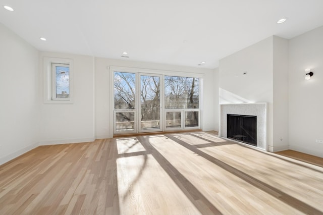 unfurnished living room featuring light wood-type flooring