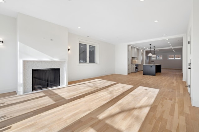 unfurnished living room with light hardwood / wood-style floors