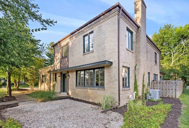 view of front of home featuring cooling unit