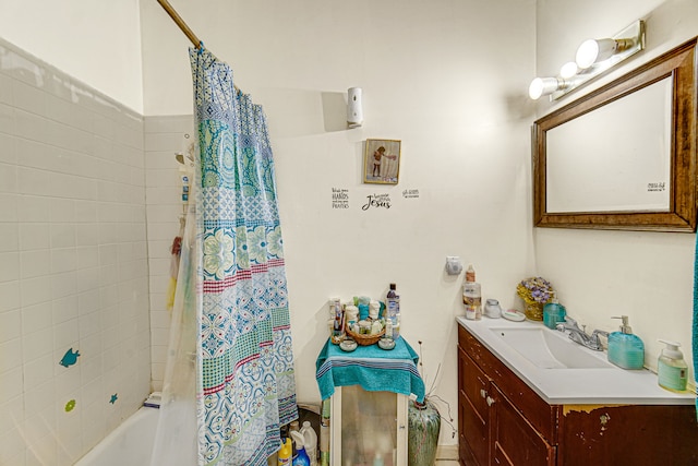 bathroom featuring vanity and shower / bathtub combination with curtain