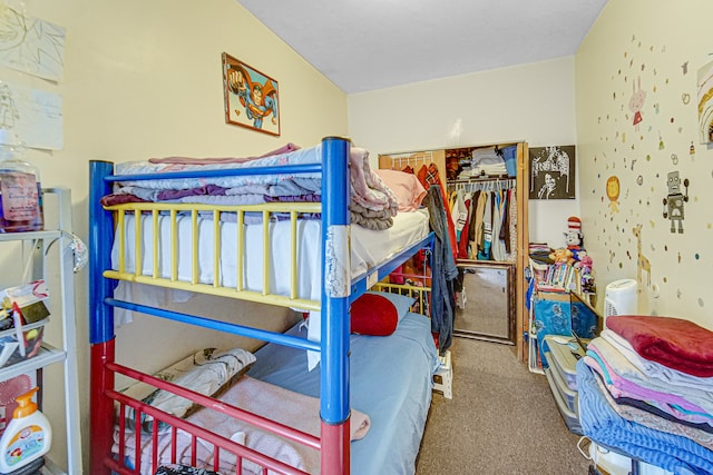 bedroom featuring a closet and carpet flooring