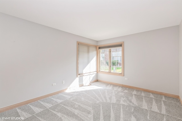 empty room with light colored carpet