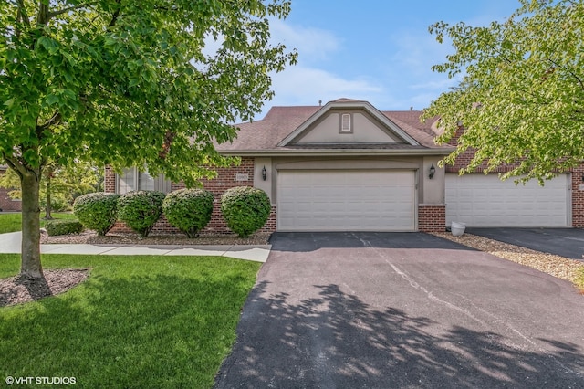 view of front of house featuring a garage and a front yard