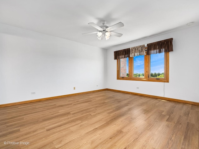 unfurnished room featuring ceiling fan and light hardwood / wood-style floors