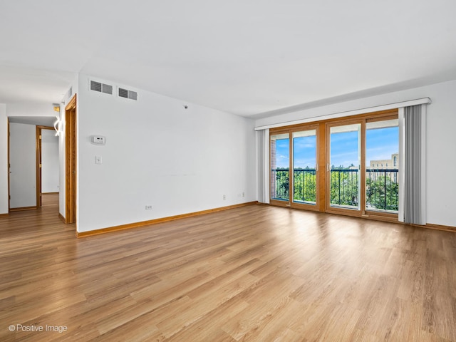 spare room with light wood-type flooring