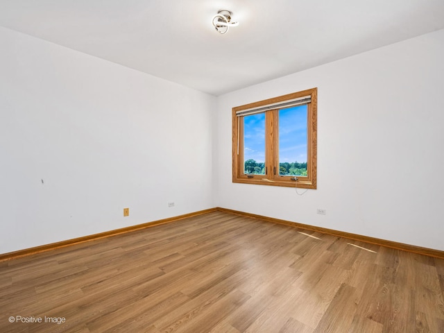 unfurnished room with light hardwood / wood-style floors