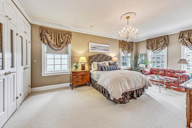 bedroom with ornamental molding, an inviting chandelier, and light colored carpet