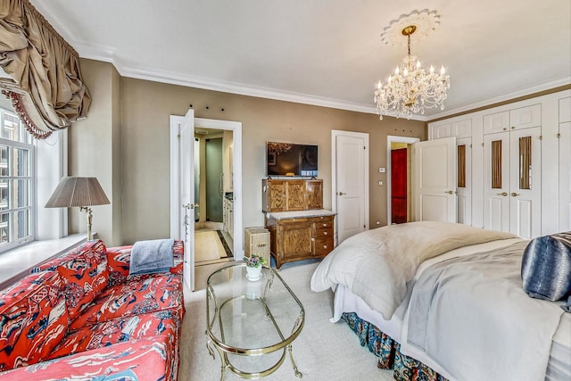 bedroom featuring crown molding and a chandelier