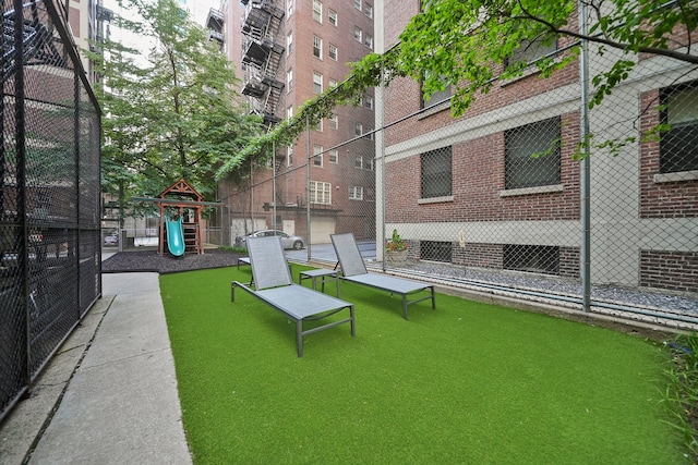 view of property's community featuring a playground