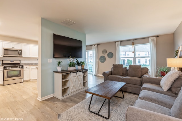 living room featuring light wood-type flooring