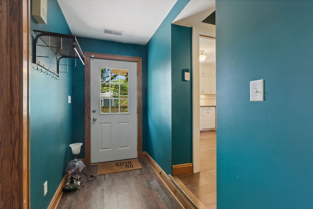 entryway with hardwood / wood-style floors