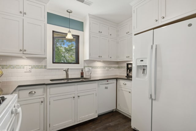 kitchen featuring decorative light fixtures, white appliances, white cabinetry, and sink