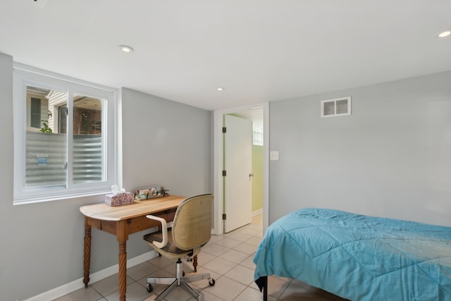 bedroom with light tile patterned floors