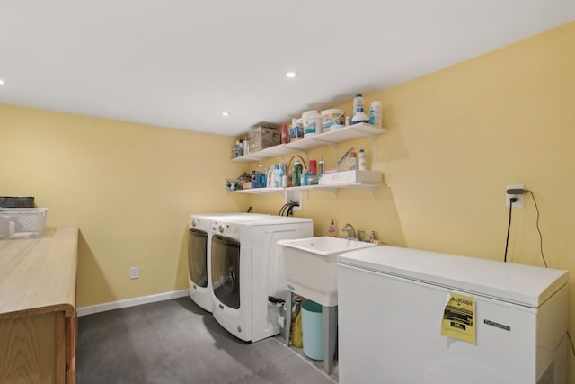 clothes washing area with washer and clothes dryer