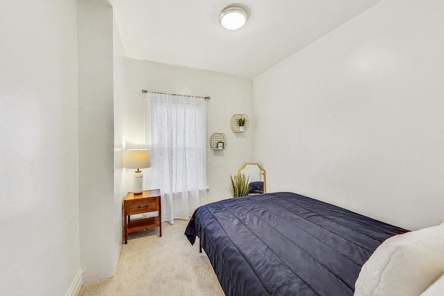 carpeted bedroom with baseboards