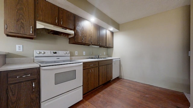 kitchen with dishwasher, sink, white electric range oven, dark brown cabinetry, and dark wood-type flooring