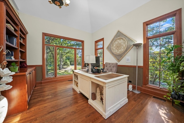 office featuring high vaulted ceiling and dark hardwood / wood-style flooring