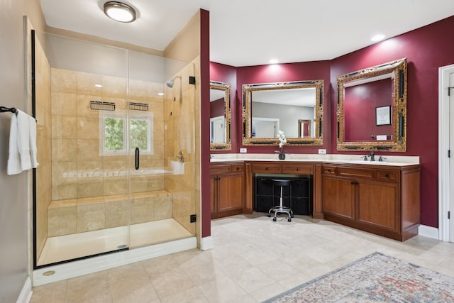 bathroom with an enclosed shower, tile patterned floors, and vanity