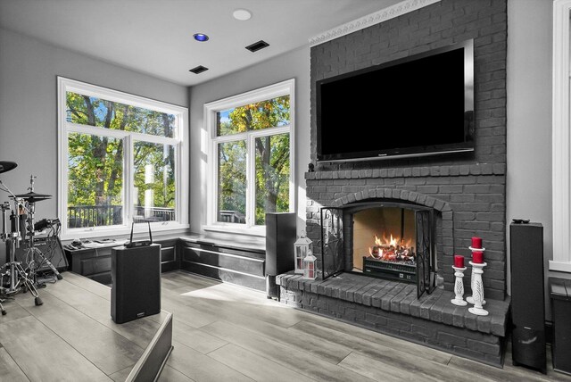 kitchen with a breakfast bar area, dark wood-type flooring, decorative columns, sink, and backsplash