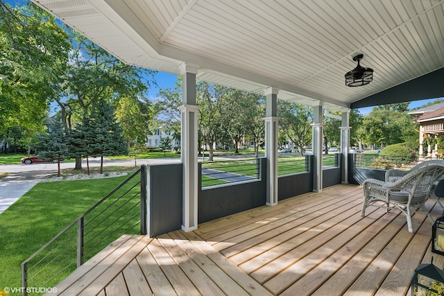 deck featuring a yard and a porch