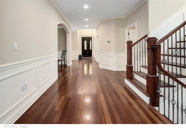 hall featuring crown molding and dark hardwood / wood-style floors