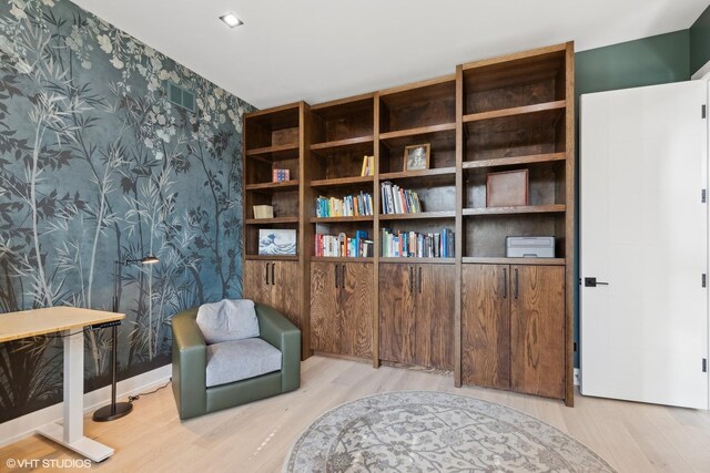 sitting room with light hardwood / wood-style floors