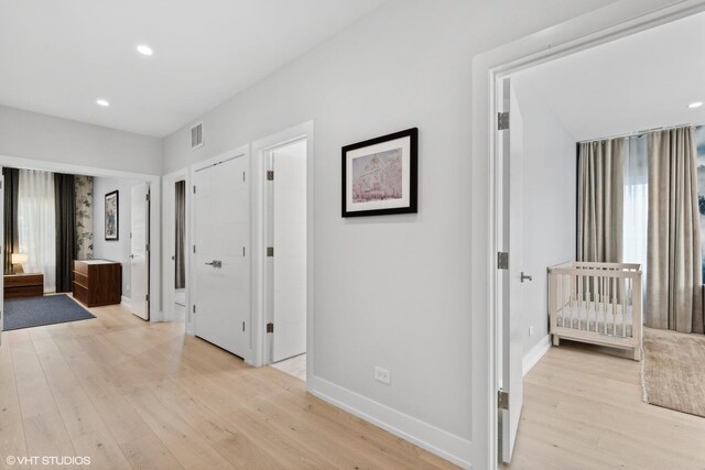 hall featuring light hardwood / wood-style flooring