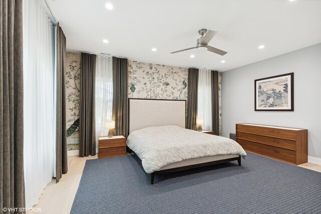 bedroom featuring light wood-type flooring and ceiling fan