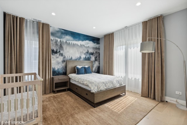 bedroom featuring recessed lighting, wood finished floors, and baseboards