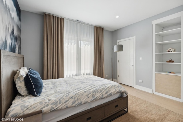 bedroom featuring recessed lighting, light wood-style flooring, and baseboards