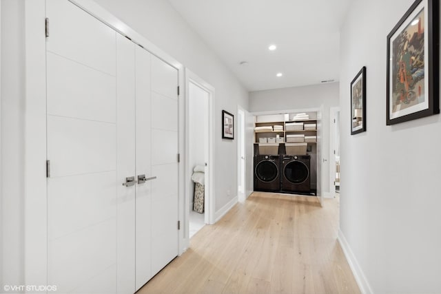 hallway with recessed lighting, baseboards, independent washer and dryer, and light wood finished floors