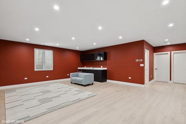 interior space featuring visible vents, light wood-style flooring, recessed lighting, and baseboards