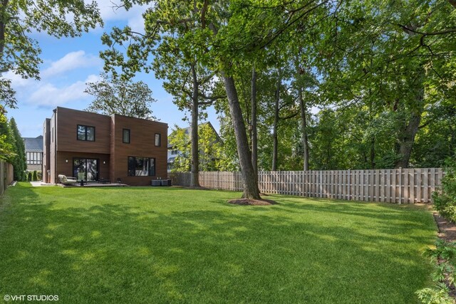 view of yard with central AC