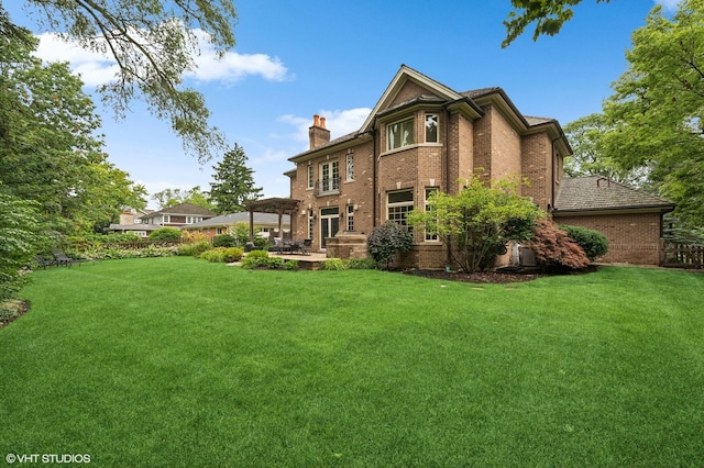 back of house featuring a yard