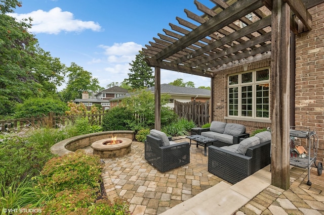 view of patio / terrace featuring an outdoor living space with a fire pit and a pergola