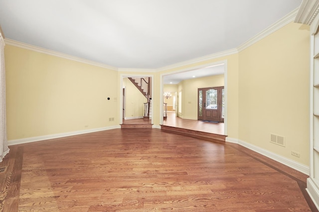 unfurnished room featuring hardwood / wood-style flooring and ornamental molding