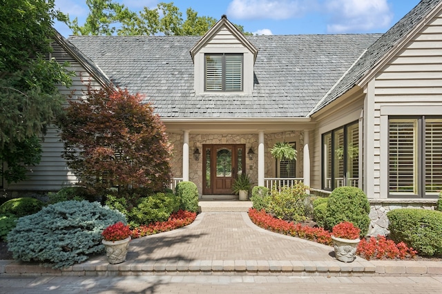 doorway to property featuring covered porch