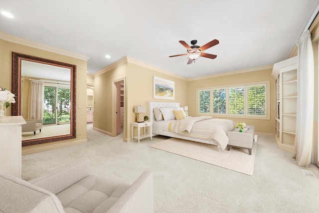 carpeted bedroom featuring multiple windows, crown molding, a walk in closet, and ceiling fan