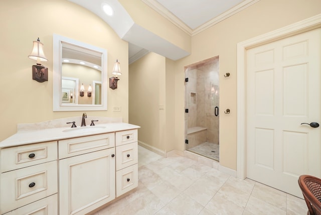 bathroom with ornamental molding, vanity, and walk in shower