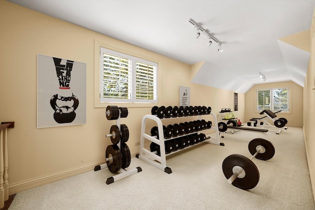 workout room with vaulted ceiling