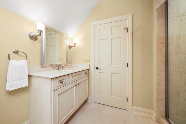 bathroom with vanity, an enclosed shower, and vaulted ceiling