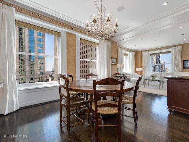 dining room featuring a notable chandelier, crown molding, and dark hardwood / wood-style flooring