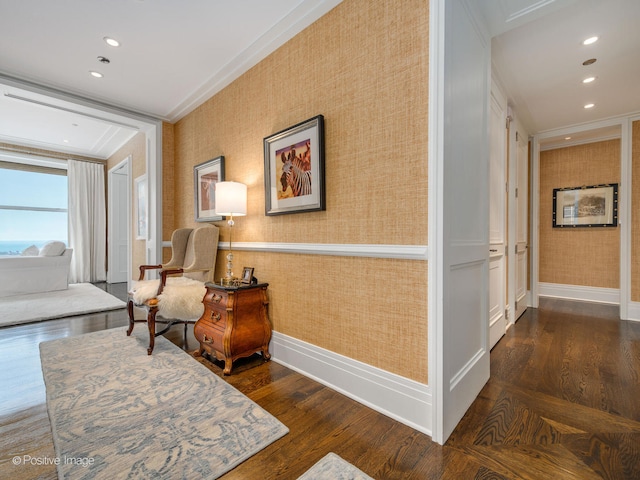 sitting room featuring crown molding and dark wood-type flooring