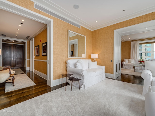 living room featuring ornamental molding and dark hardwood / wood-style flooring