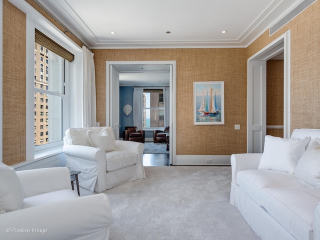 carpeted living room featuring crown molding