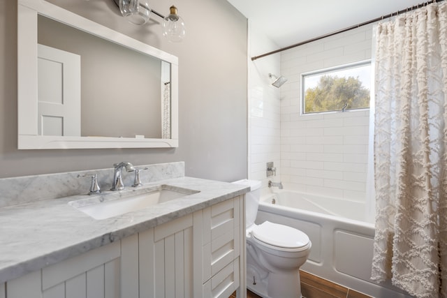 full bathroom with shower / bathtub combination with curtain, wood-type flooring, vanity, and toilet