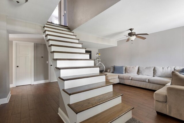 interior space featuring ceiling fan and dark hardwood / wood-style flooring