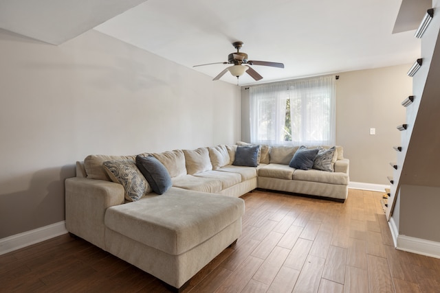 living room with ceiling fan and hardwood / wood-style flooring